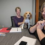 dog sitting on desk in PNW Insurance Group office