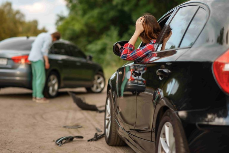 male-female-drivers-after-car-accident-road-min