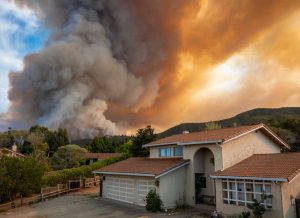 wildfire threatening home